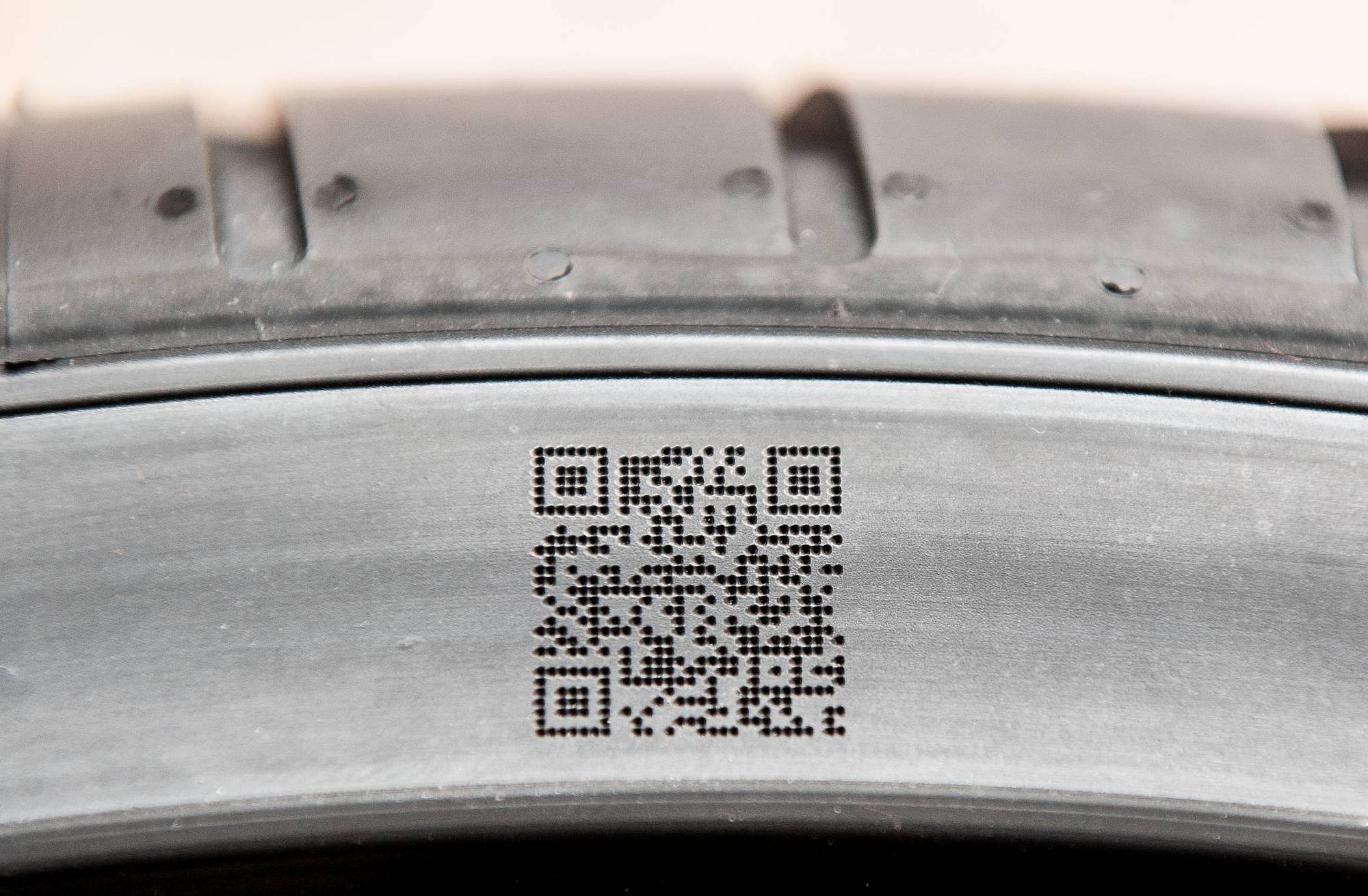 Laser engraved QR Code on a tire sidewall – black on black Laser engraved QR Code on a tire sidewall – black on black