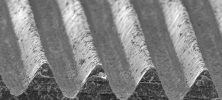 A microscope image shows the very small, regular structures on the aircraft paintwork.