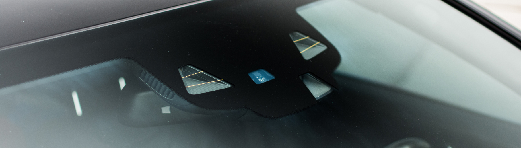 Photo of a windshield with integrated sensors.